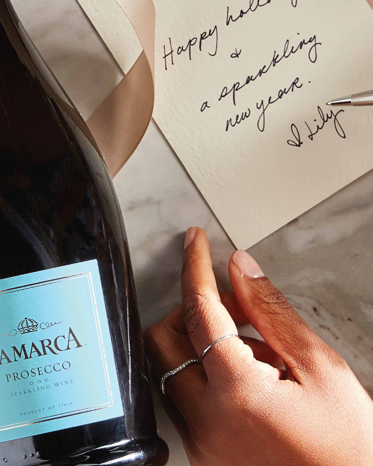 glass and bottle of La Marca Prosecco 